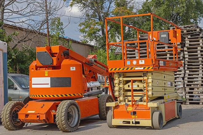 warehouse forklift in operation with stacked inventory in Aromas